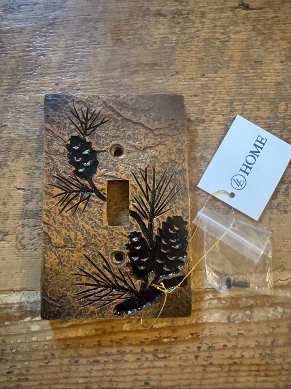 Pinecone Relief Single Toggle Wall Plate in Antique Copper Finish